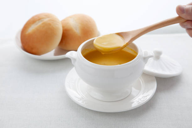 pumpkin potage soup isolated on table