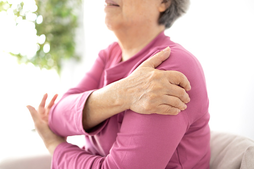 Senior woman shoulder pain osteochondrosis