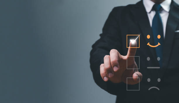 istock Customer service and Satisfaction concept, Business people are touching the virtual screen on the happy Smile face icon to give satisfaction in service. Men's hands doing online satisfaction rating. 1989319118