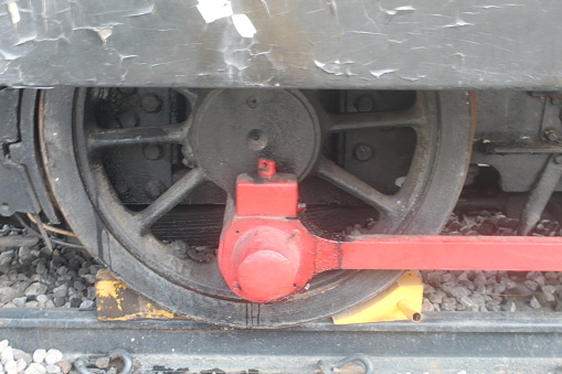 Close up of old school train wheels with black and red color dominance. suitable for train theme.