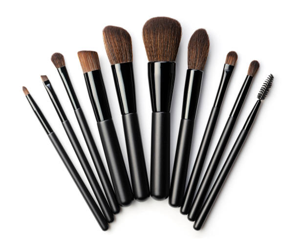 istock Set of black makeup brushes isolated on white background. Top view. 1989338217