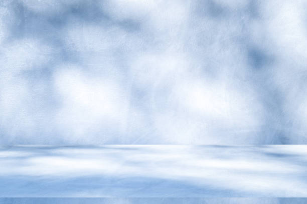 istock Wall interior background, studio, and backdrops show products. with shadow from window color white and blue light. background for text insertion and presentation of product 1989389550