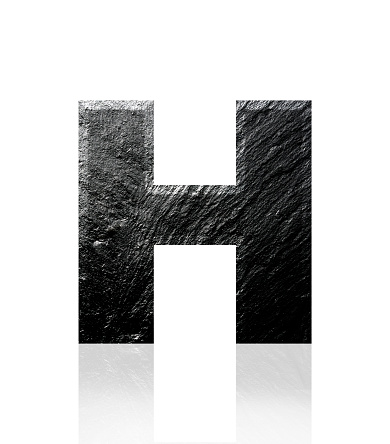 Close-up of three-dimensional slate alphabet letter H on white background.