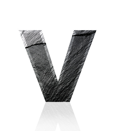 Close-up of three-dimensional slate alphabet letter V on white background.
