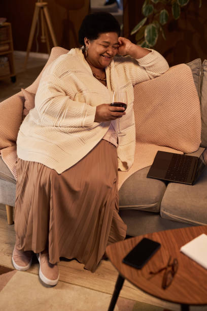 istock Senior Black Woman Enjoying Relaxing Evening 1989444404