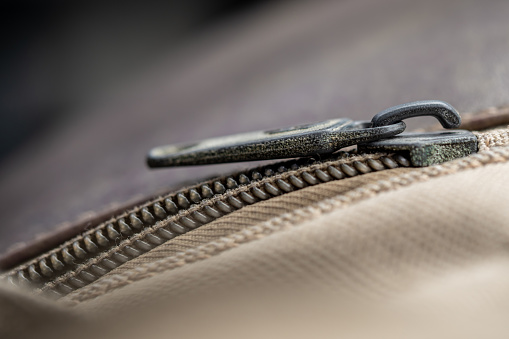close-up to the zipper of the old cloth bag