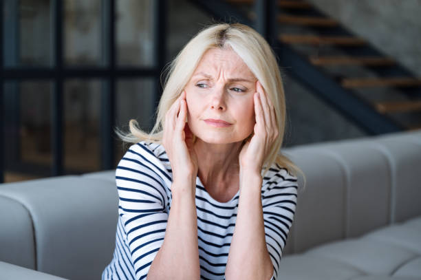 istock Frustrated middle aged woman suffering from headache 1989464806