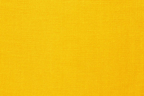istock Yellow linen fabric cloth texture for background, natural textile pattern. 1989471677