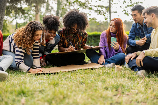 istock group of multiracial friends demonstrating with banners 1989472706