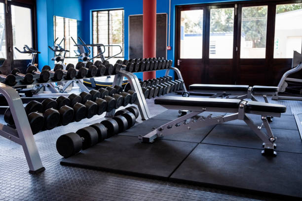 istock Assortment of dumbbells on rack at gym 1989486897