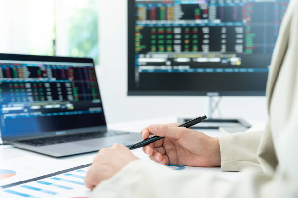 istock Business women calculate benefit, spreadsheets, graph financial development, bank accounts, statistics, economy, data analysis, investment analysis, stock exchange,Interest rates, incom 1989488490