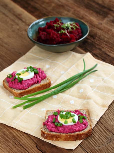 istock Beetroot mixed with goat cream cheese spreaded on whole grain bread. 1989490597