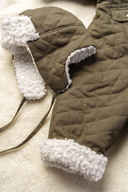 istock Gray quilted baby overalls for winter flat lay 1989503796