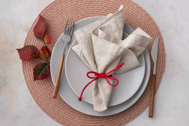 istock Fall table arrangement with plates and napkin overhead view 1989507962