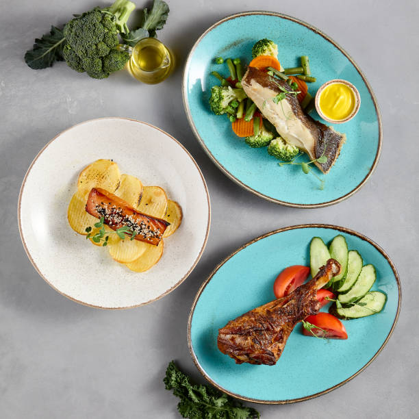 istock Assorted fish dishes featuring sea bass, halibut, and salmon, beautifully presented for culinary variety and seafood cuisine 1989509629
