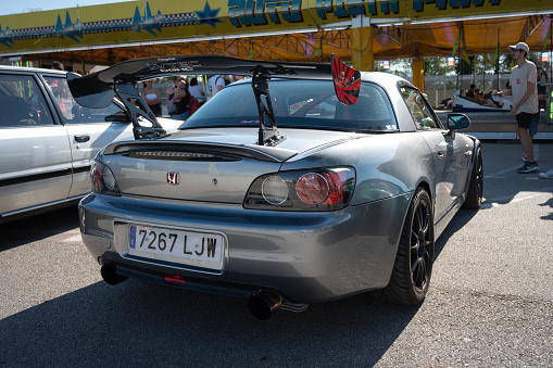 Montmelo, Spain – December 15, 2023: Rear view of the classic Japanese sports car from the 90s, the two-seater Honda S2000 with gray spoiler