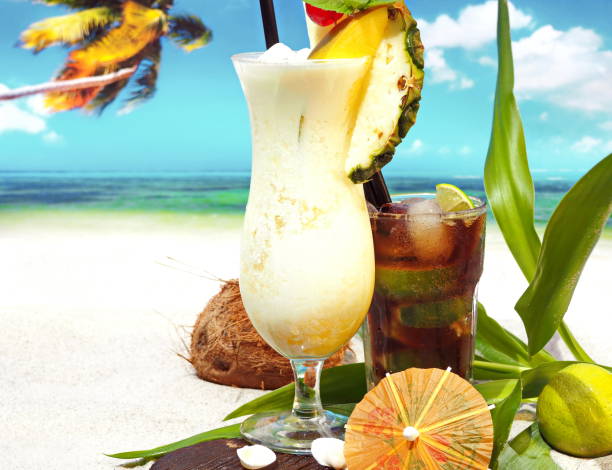 istock Pina Colada - Coconut Cocktail on tropical Background 1989530292