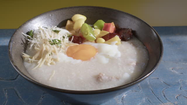 Congee or rice porridge with pork and soft boiled egg, Chinese food.
