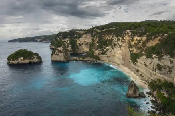 Beautiful, scenic Diamond Beach bay cliffs, sea tacks and turquoise ocean water on  tropical Nusa Penida island
