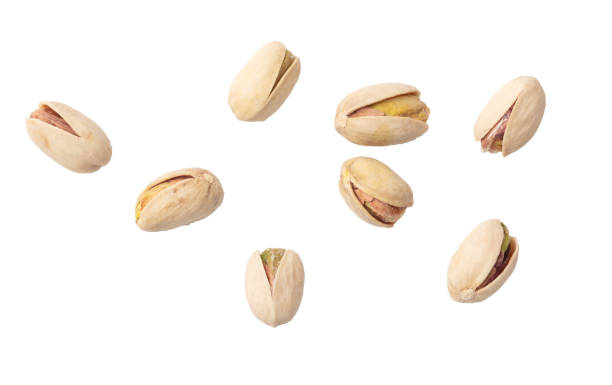 istock Fresh pistachios isolated on white background. Macro 1989585394