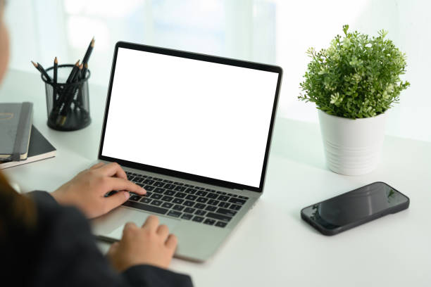 istock Businesswoman typing on laptop keyboard. Blank display for your text 1989588145