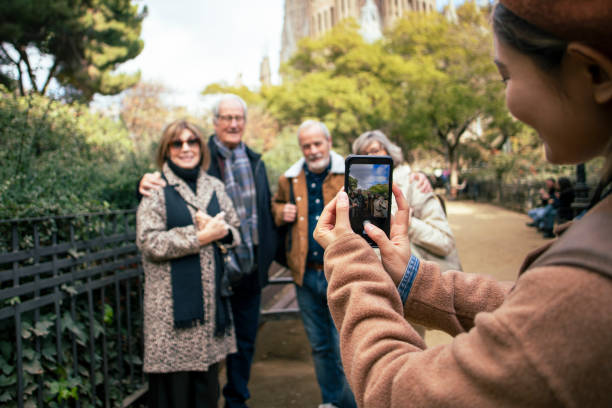 istock Senior friends with guide visiting the city 1989595536