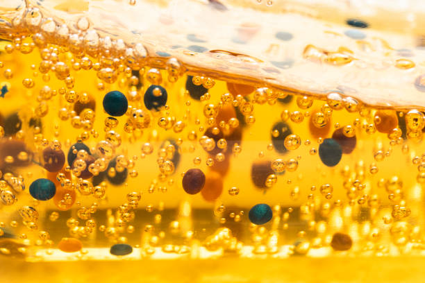 istock Cosmetic texture yellow with cleansing particles macro. Skin care, moisturizing. 1989601996