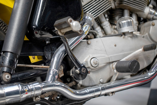 Close up of chrome motorcycle exhaust pipes.