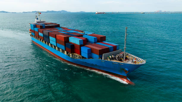 istock logistic cargo container ship sailing in sea to import export goods and distributing products to dealer and consumers across worldwide, aerial front view 1989611732