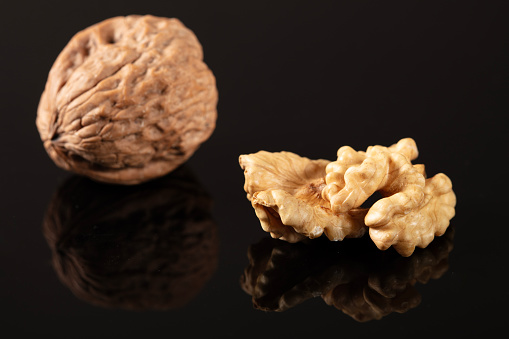 walnuts on black background