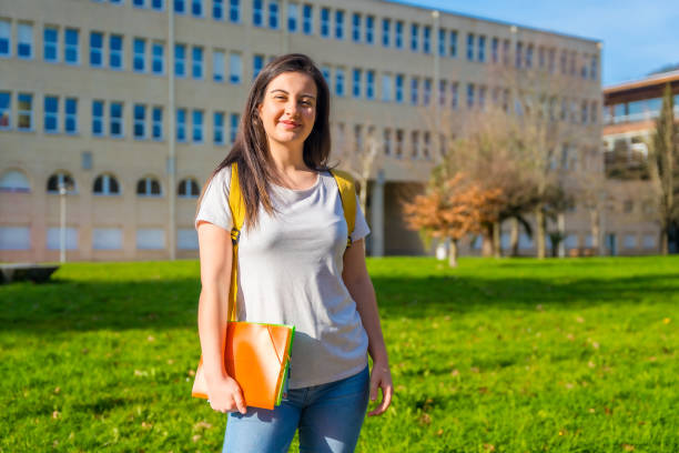 istock Cheerful student outside the university college 1989629845