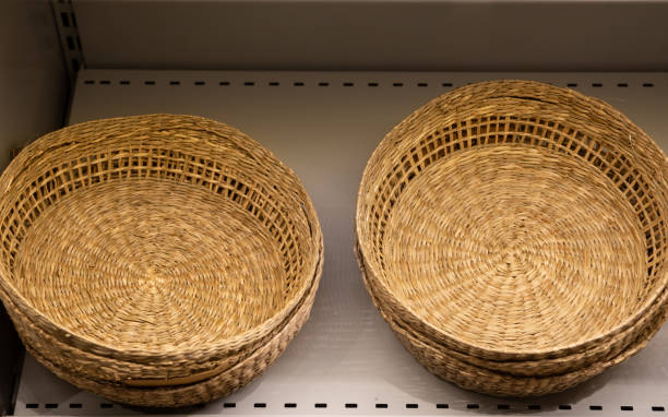 istock Natural wicker basket in the shop. Fruit bread container. Willow handwoven art. 1989660538