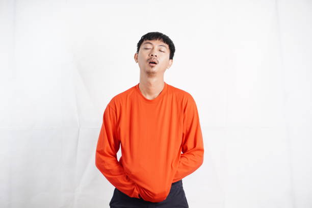 istock young man being demotivated for daily 1989665924
