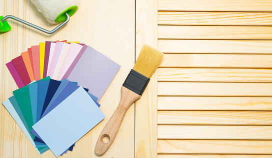 Wooden surface and tools for painting and repair, color palette