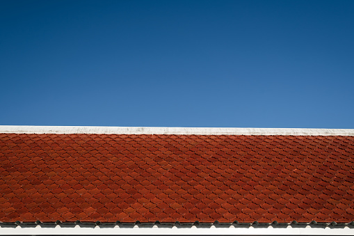 Close up of roof with blue sky.