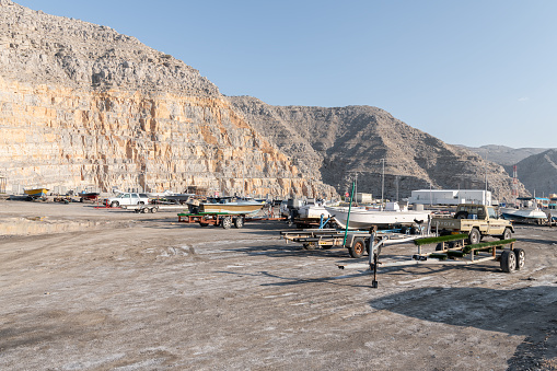 Boats and trailers in the car park at Khasab Harbour, Mussandam, Oman