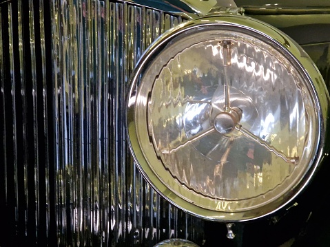Close up of old headlight on old car