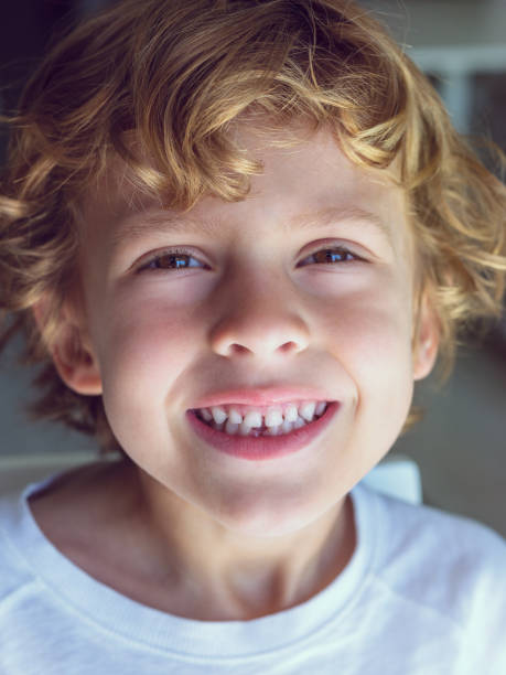 istock Happy little boy smiling at camera 1989696555