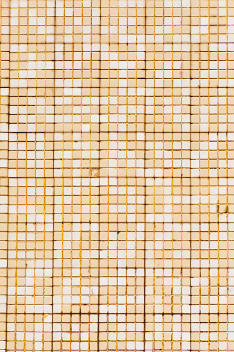 Beige and white old-fashioned small tiles pattern background. Gresite. Full frame view suitable for background purposes. Fishing village tradition , Vilagarcía de Arousa, Pontevedra province, Galicia, Spain. Antiquities.