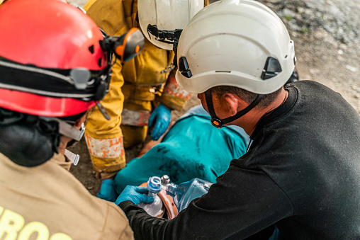 Paramedics doing CPR in an accident victim