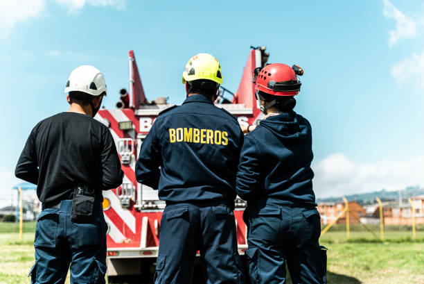 istock Firefighters looking to a fire engine outdoors 1989749776