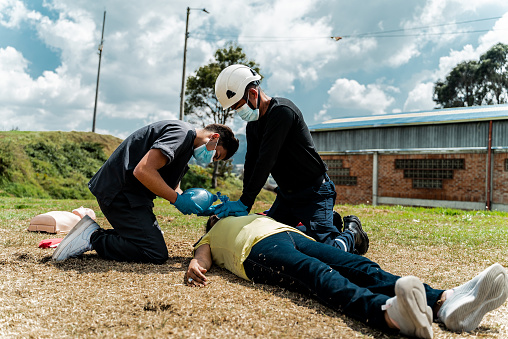 Paramedics doing CPR on a accident victim
