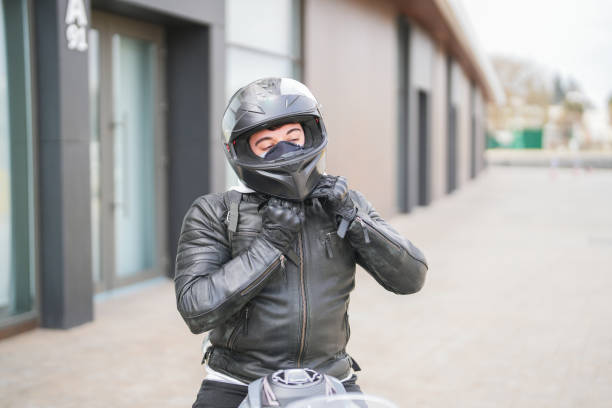 istock Young man riding a racing motorcycle wears a helmet 1989769384