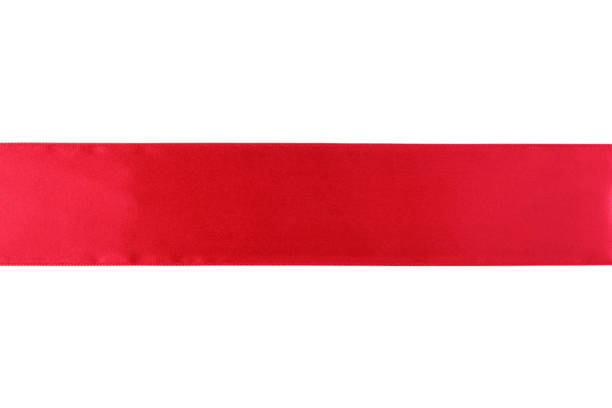 istock Red satin ribbon isolated on white background. 1989794775