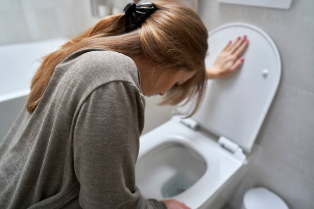 istock Woman bending over toilet and having a nausea 1989809167