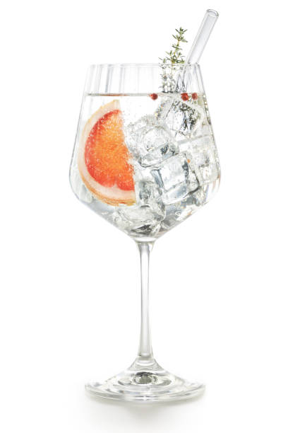 istock Gin tonic glass with pink grapefruit on white 1989815428