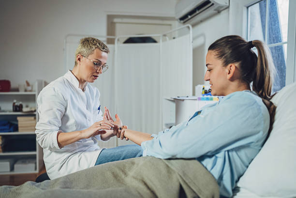 istock Doctor examining female patient 1989818594