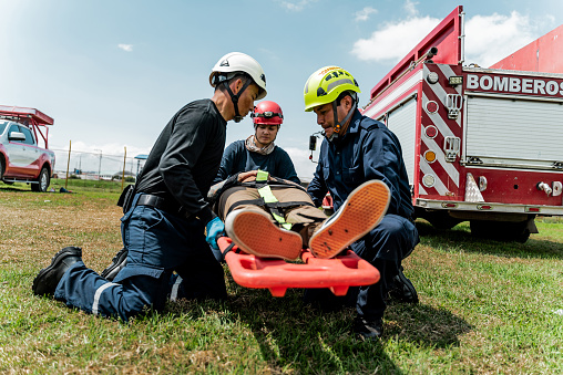 Paramedics helping an accident victim