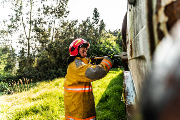 istock Firefighter using a crowbar to break down a vehicle door in an accident 1989827171
