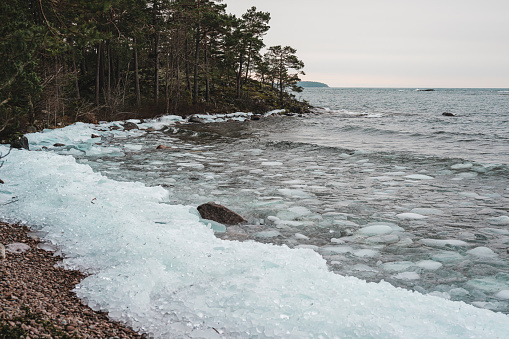 Ice pebbles on shore of lake Vättern in Sweden